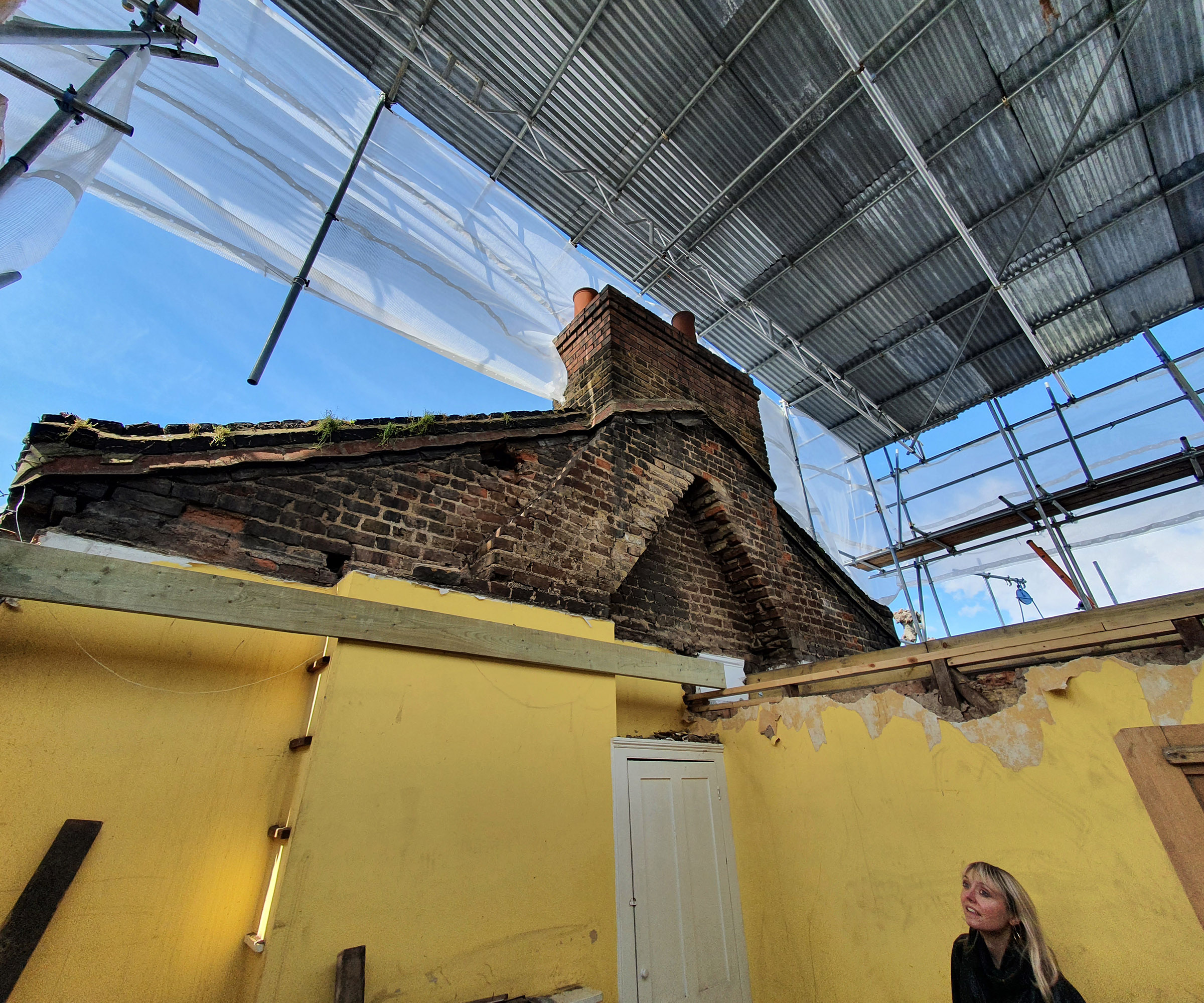 progress pics of a loft conversion with a "scaffolding hat" to protect the build from advers weather