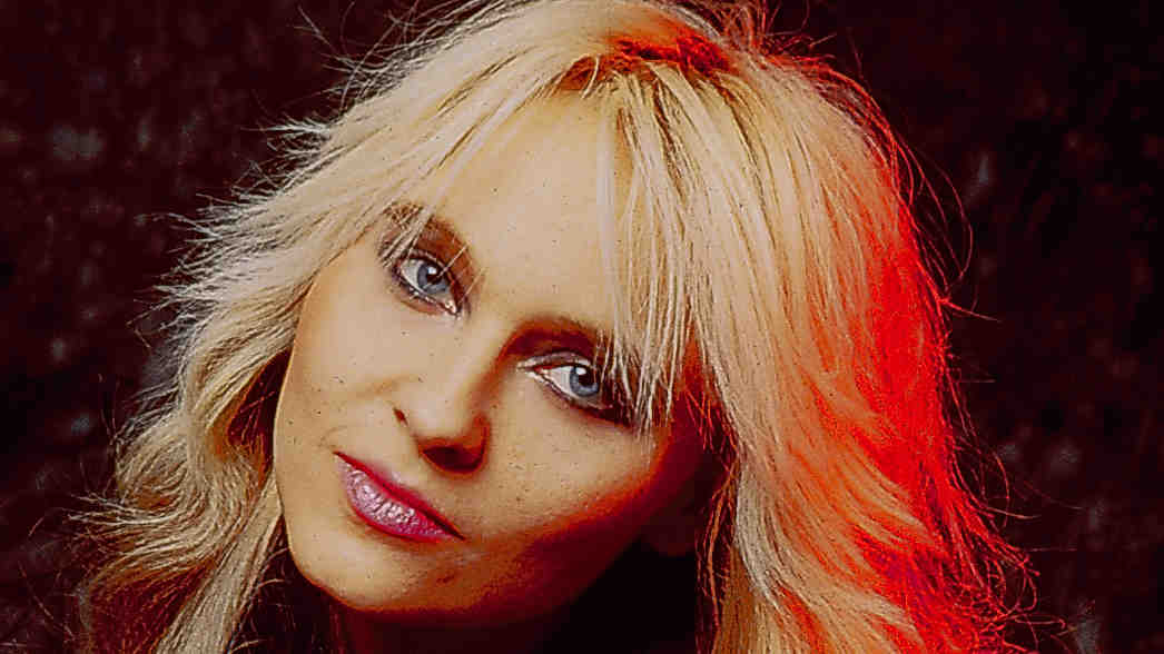 Doro Pesch posing for a photograph in the 1980s