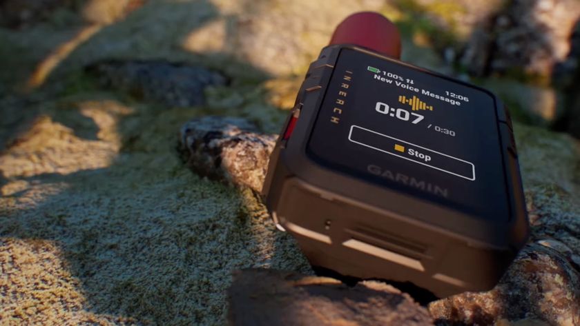The Garmin InReach Mini 3 sitting on a rock, showing a new voice message.