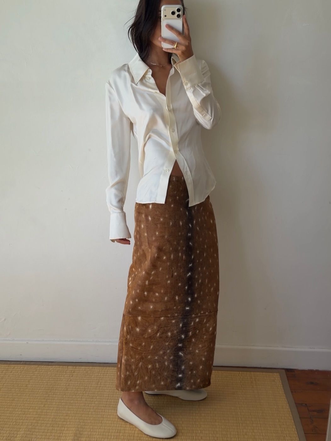 An image of a woman wearing white flats, shoe trend for spring 2026.