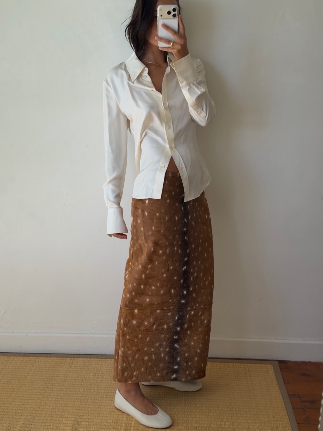 An image of a woman wearing white flats, shoe trend for spring 2026.