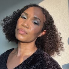 A beauty editor wearing Danessa Myricks Lightwork VII Palette