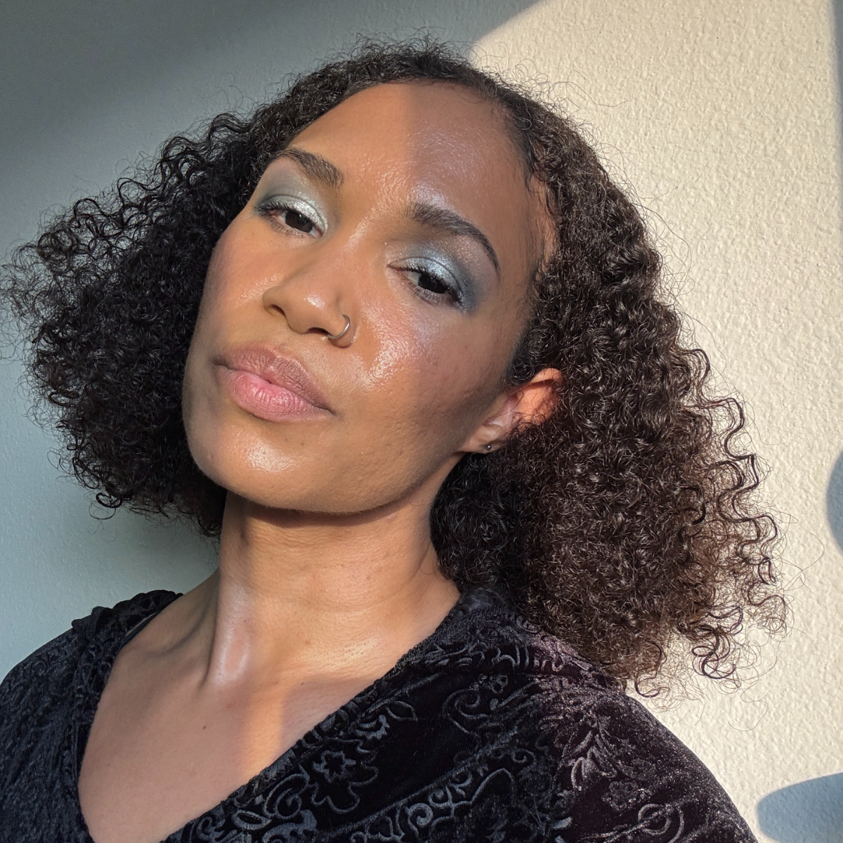 A beauty editor wearing Danessa Myricks Lightwork VII Palette