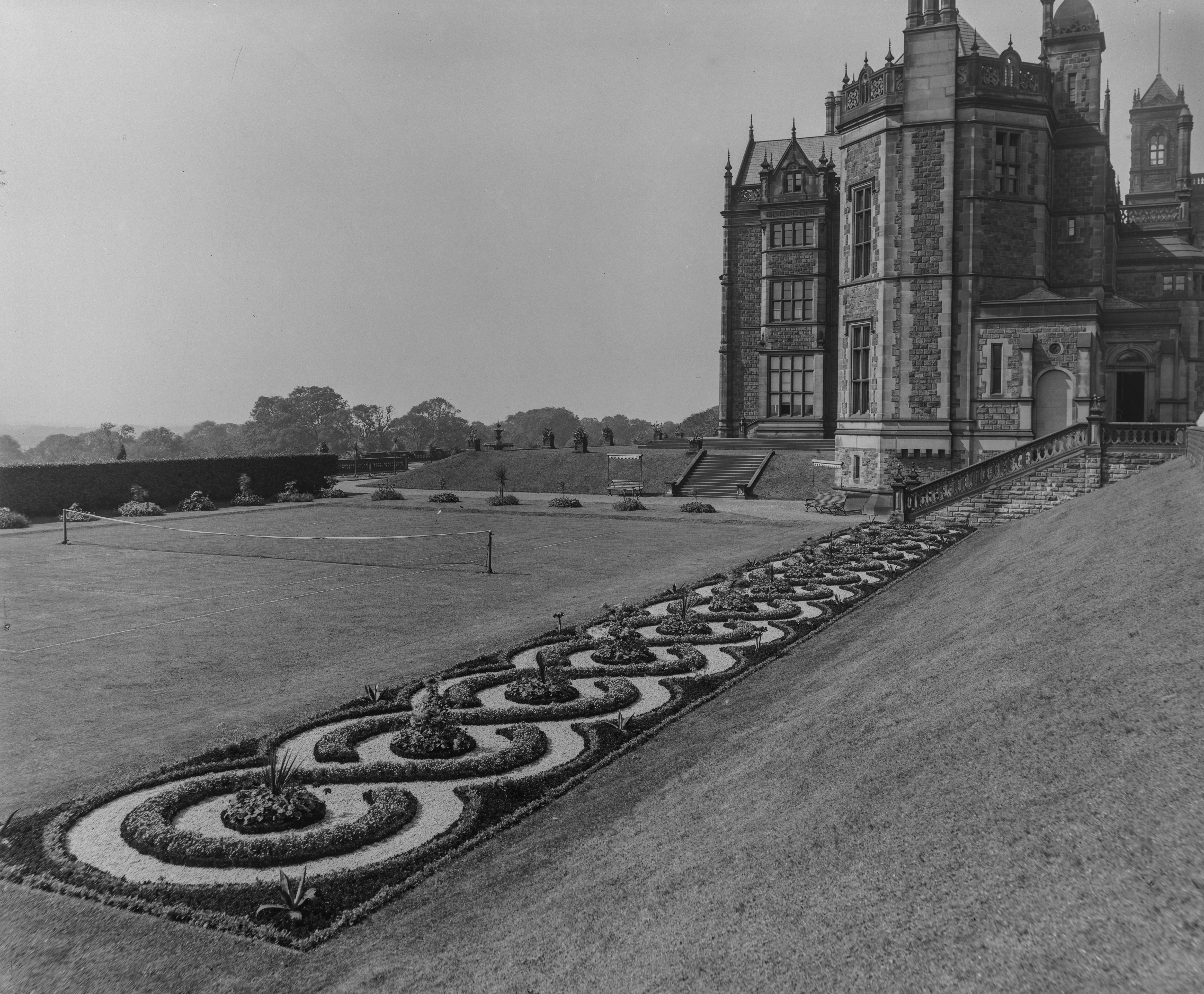 The immaculate tennis court and croquet lawn.