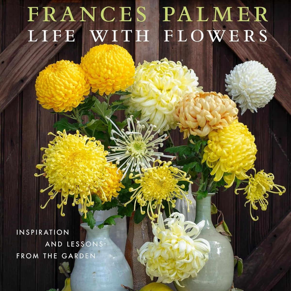 Hardback coffee table book with yellow flowers in vases