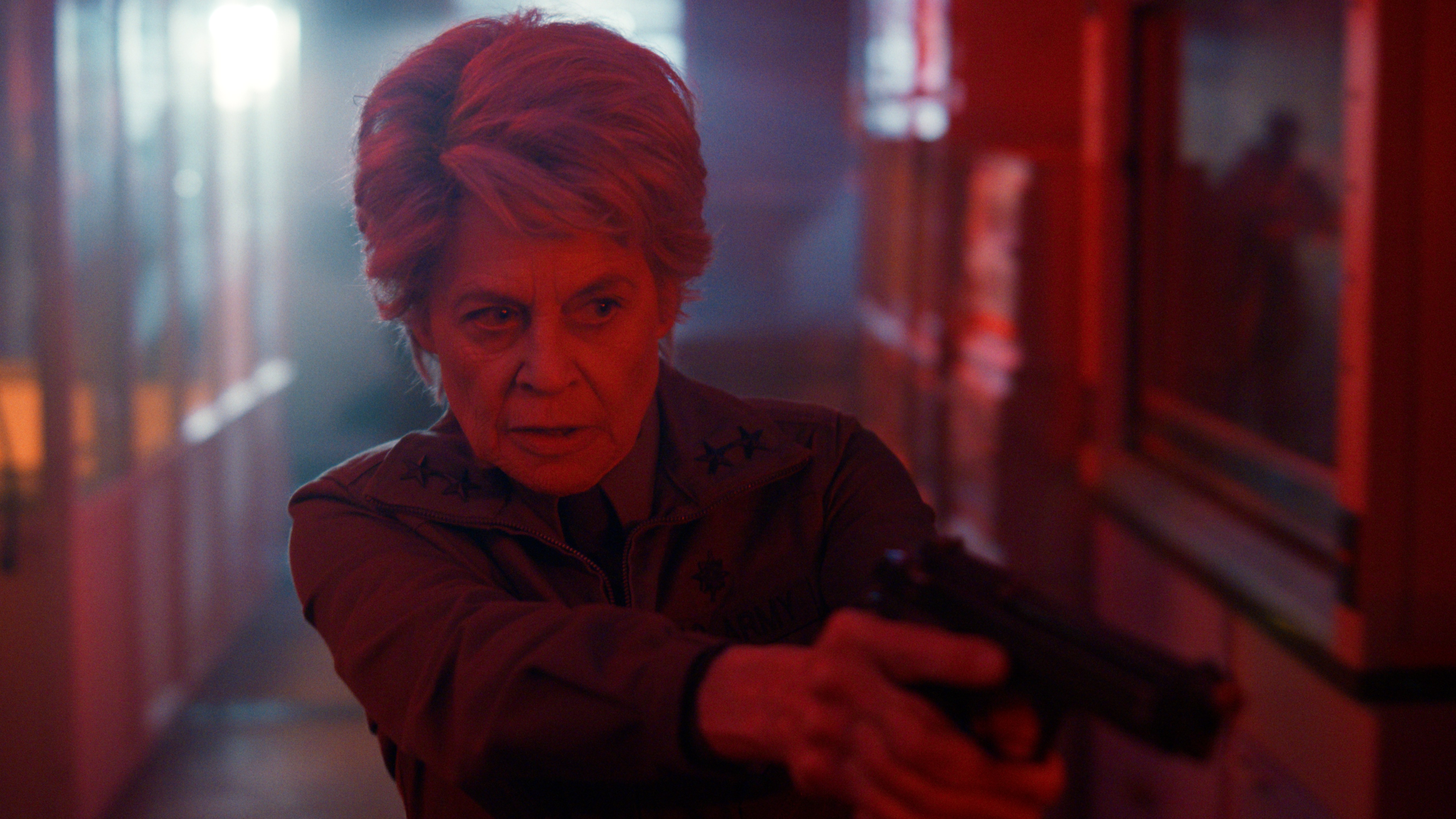 Dr. Kay (Linda Hamilton) readies a pistol in a scene from "Stranger Things" season 5
