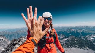 Hiking couple high fiving