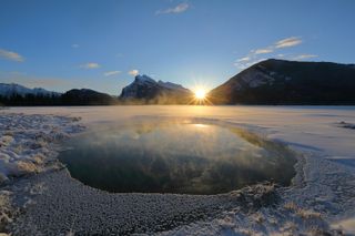 Sunrise during the winter solstice at Vermillion Lake in Banff, Canada. 