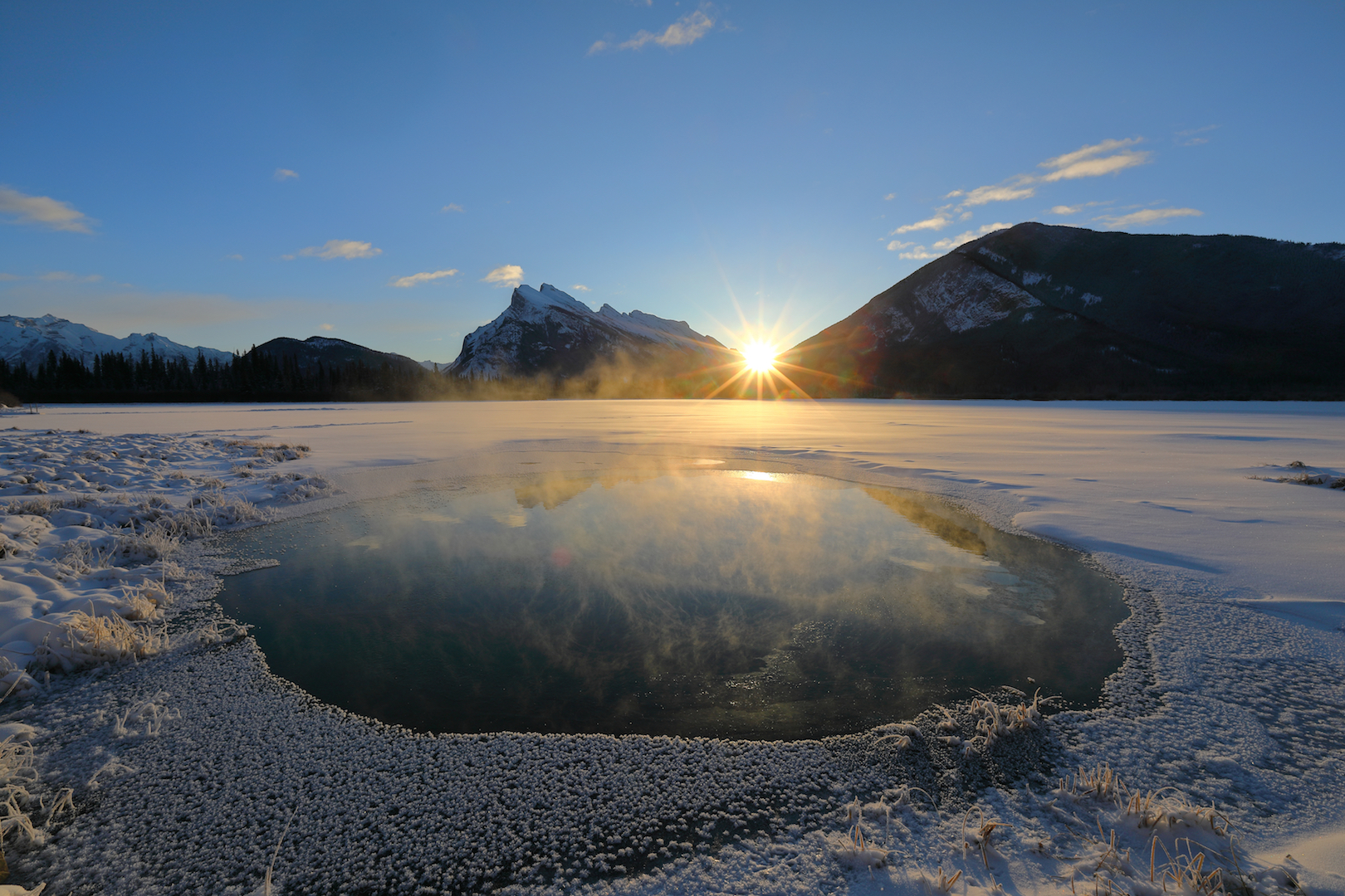 Sunrise during the winter solstice at Vermillion Lake in Banff, Canada. 