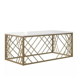 coffee table with gold angular legs and a white table top