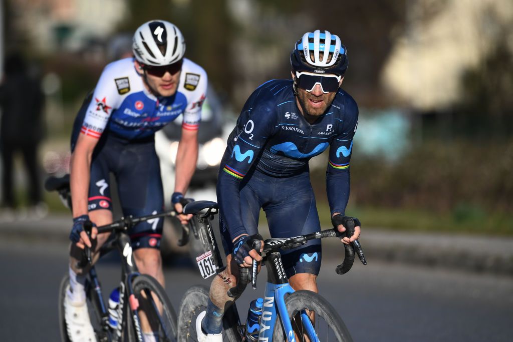 SIENA ITALY MARCH 05 Alejandro Valverde Belmonte of Spain and Movistar Team competes ahead of Kasper Asgreen of Denmark and Team QuickStep Alpha Vinyl during the Eroica 16th Strade Bianche 2022 Mens Elite a 184km one day race from Siena to Siena Piazza del Campo 321m StradeBianche WorldTour on March 05 2022 in Siena Italy Photo by Tim de WaeleGetty Images