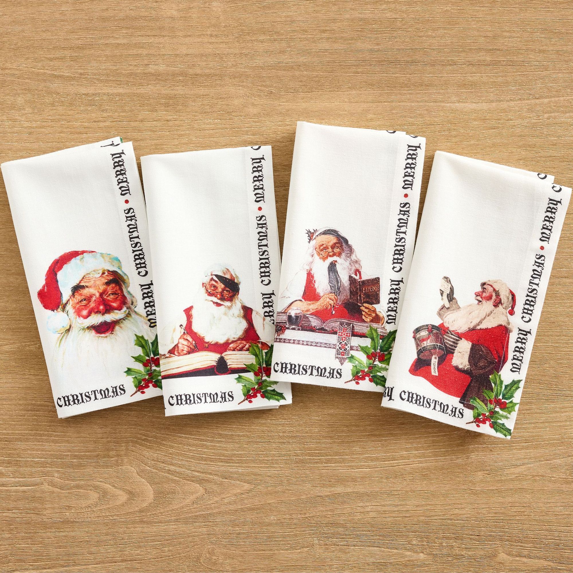 White napkins with Norman Rockwell Santa illustrations
