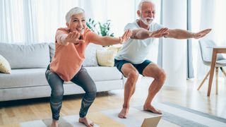 Man and woman over 50 doing a squat