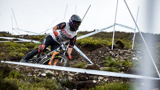 MTB racer surrounded by tape