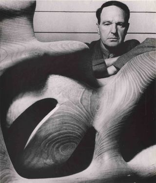 Henry Moore with one of his sculptures, shot by Bill Brandt