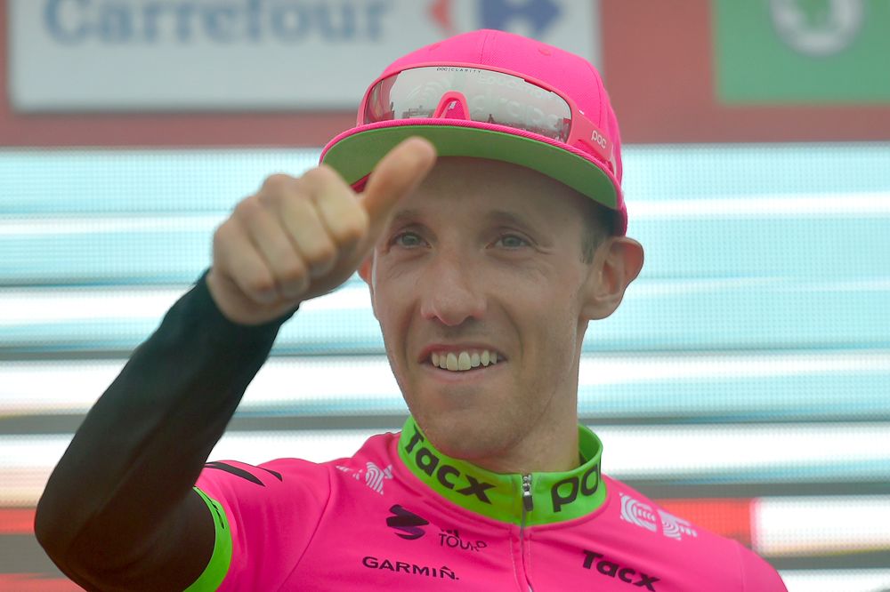Michael Woods on the Vuelta a Espana podium after winning stage 17