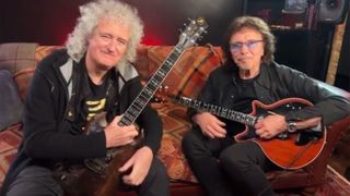 Brian May (left) and Tony Iommi swap guitars