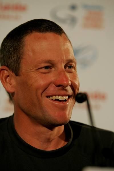 Lance Armstrong shares a laugh with the journalists during his pre-race press conference.