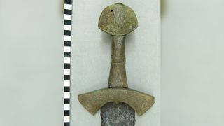 This sword was likely placed in the grave sometime after the person was buried.