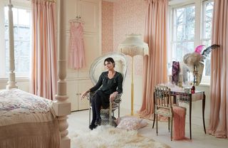 pearl lowe with bedroom and pink wallpaper wall