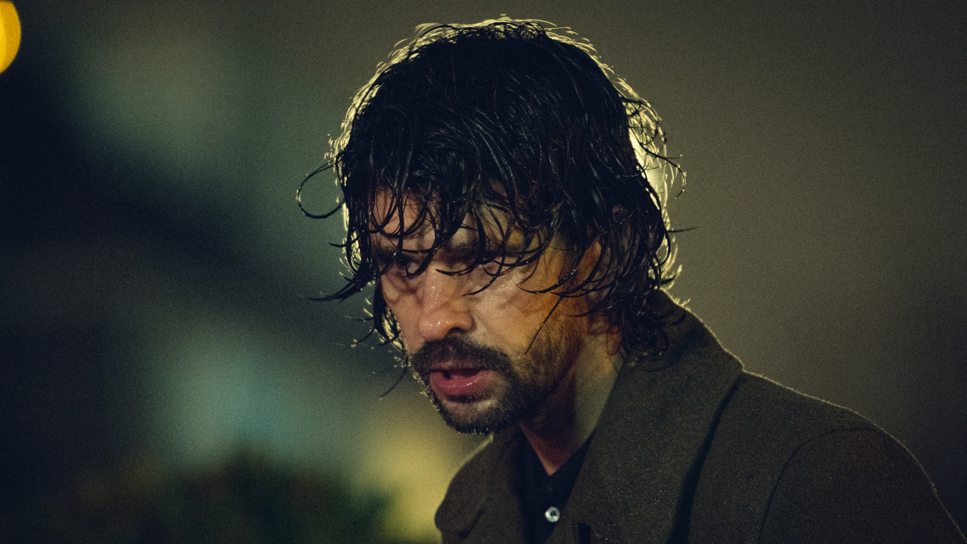 Sam is soaked in the rain in spy thriller Black Doves