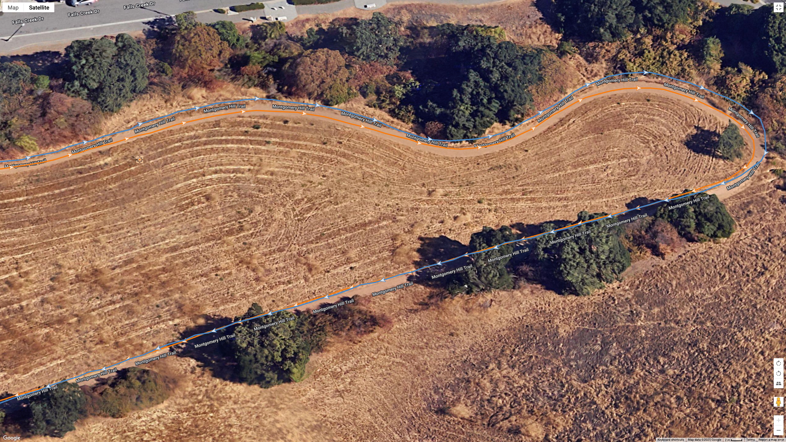 A Google Earth satellite map showing the GPS results for the Garmin Instinct 3 AMOLED (blue line) and Polar Vantage M3 (orange line) for the same run.