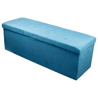 A blue suede rectangular storage ottoman