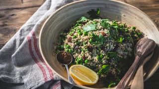 gluten-free quinoa salad bowl with lemon