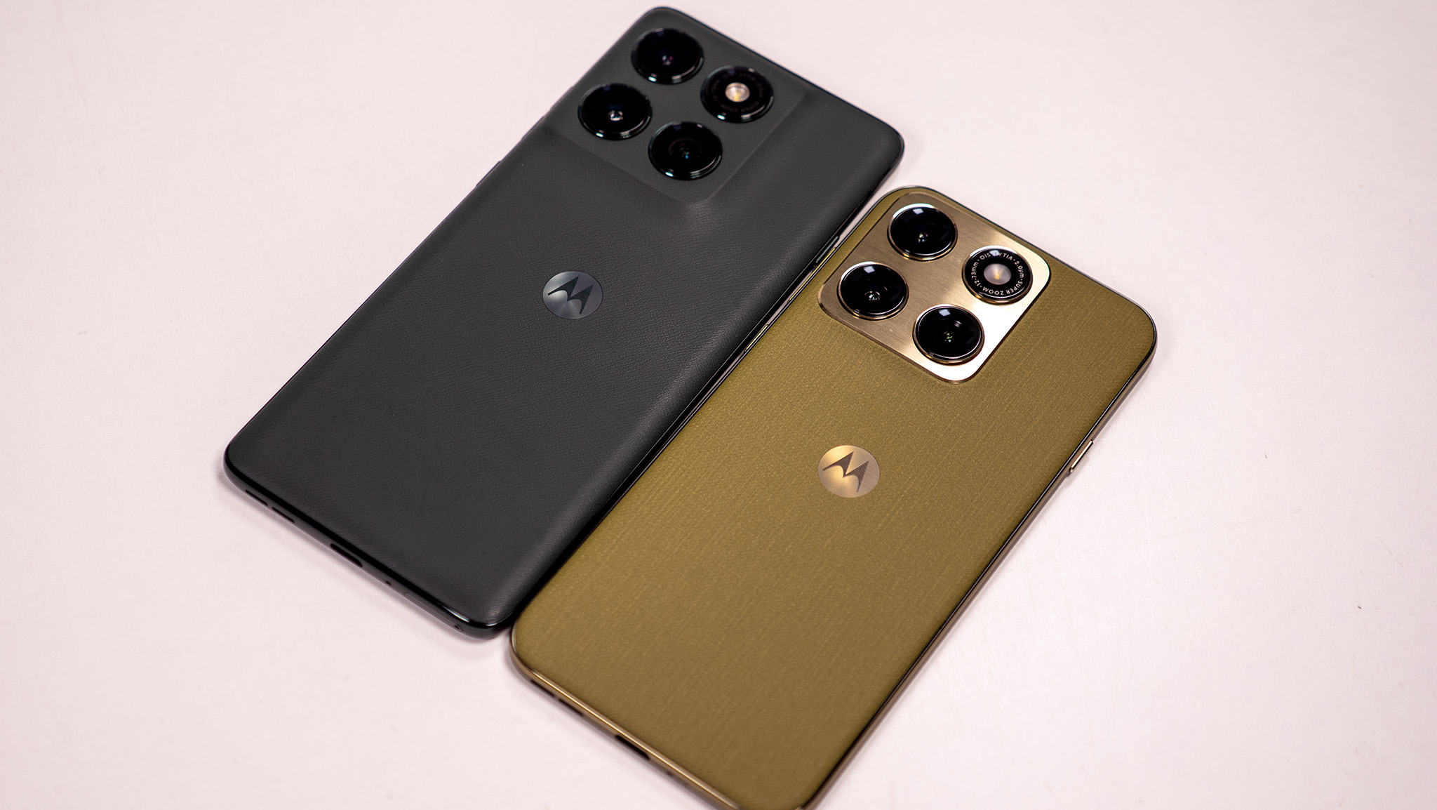 Comparing the olive green Motorola Edge 2026's design with the dark grey Motorola Edge 2025