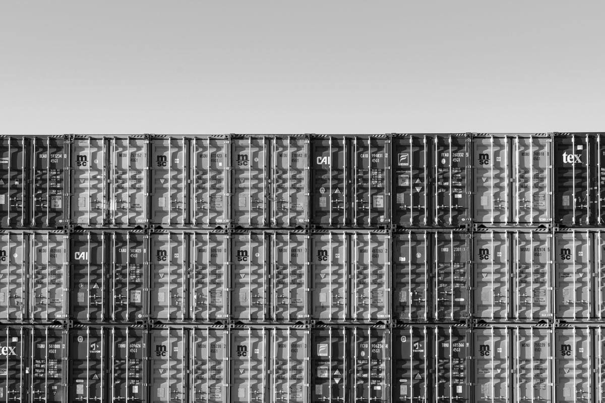 Black &amp; white photo of stacked shipping containers taken with the Pentax K-3 Mark III Monochrome