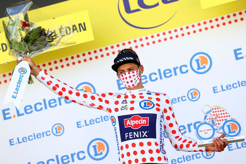 MRDEBRETAGNE GUERLDAN FRANCE JUNE 27 Mathieu Van Der Poel of The Netherlands and Team AlpecinFenix Polka Dot Mountain Jersey stage winner celebrates at podium during the 108th Tour de France 2021 Stage 2 a 1835km stage from PerrosGuirec to MrdeBretagne Guerldan 293m Trophy LeTour TDF2021 on June 27 2021 in MrdeBretagne Guerldan France Photo by Michael SteeleGetty Images