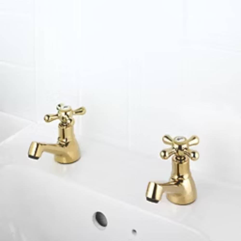 gold traditional-style bathroom basin taps