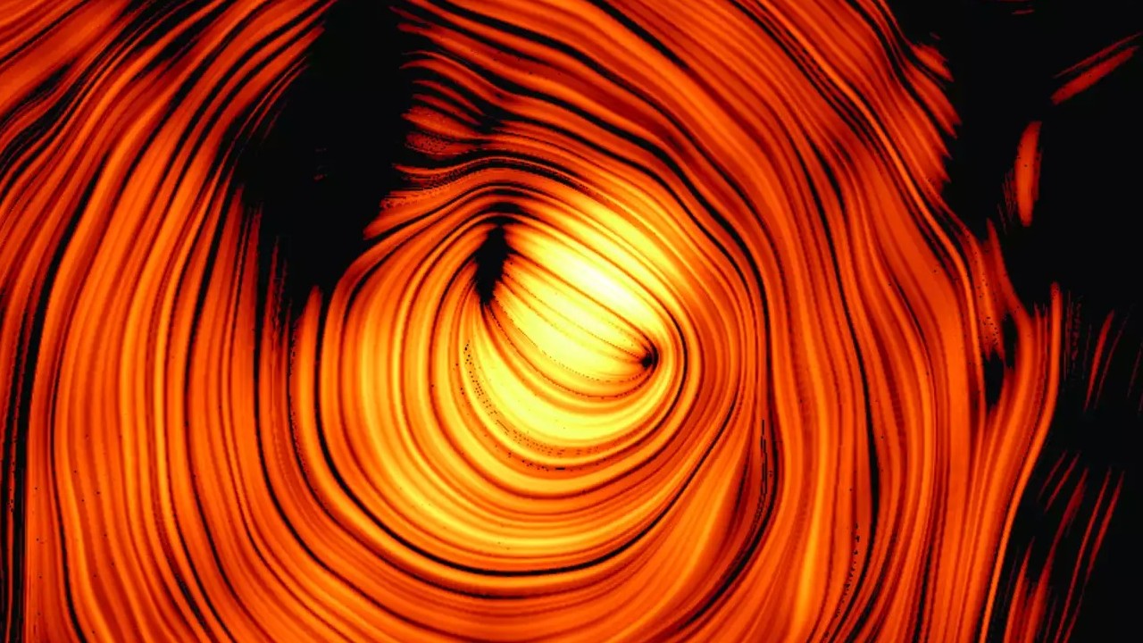 a yellow orb surrounded by red concentric rings