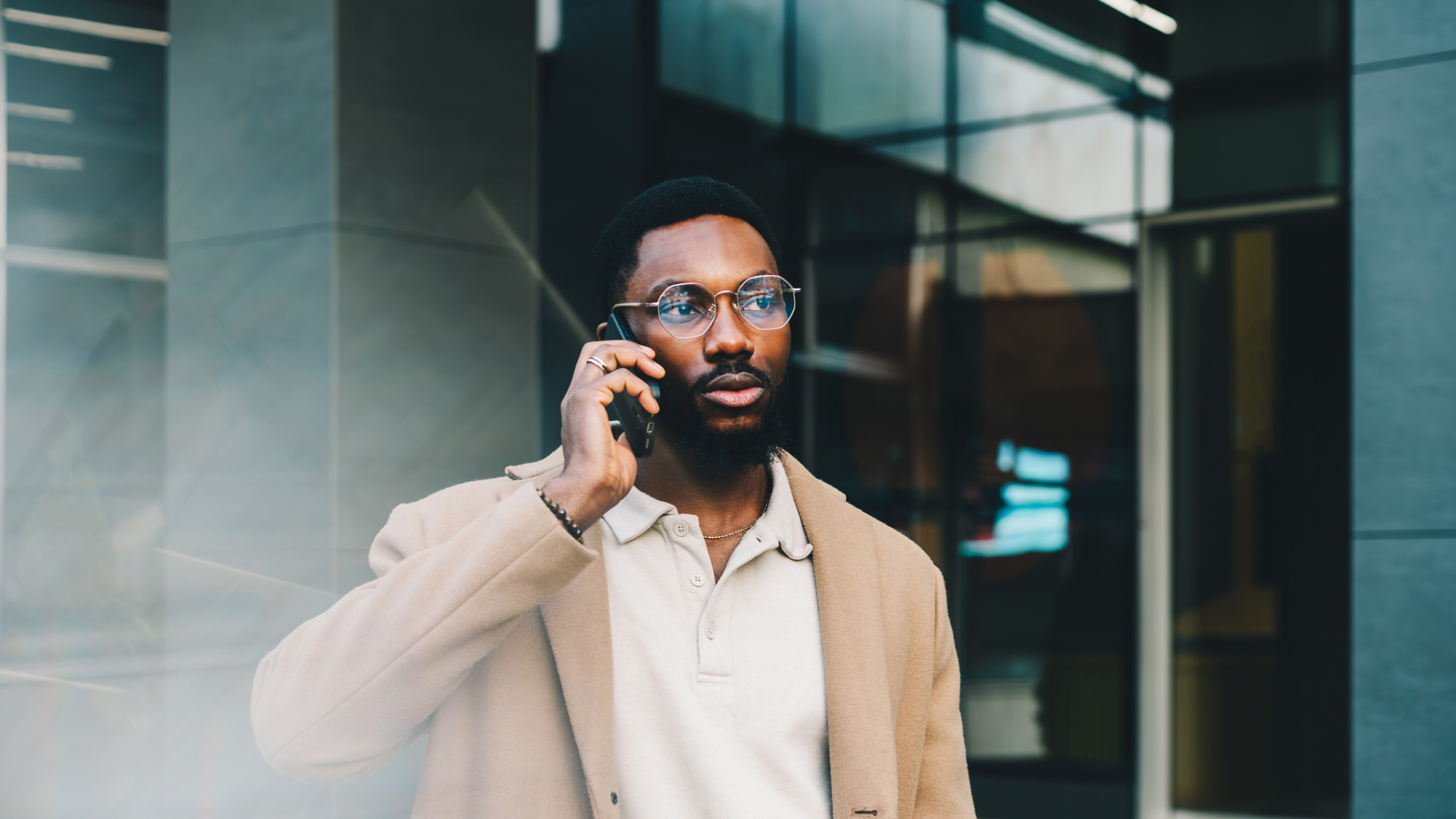 A man taking a call on a smartphone.