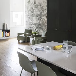 Contemporary Shaker kitchen with cantilevered dining table, monochrome feature wall mural and seating area