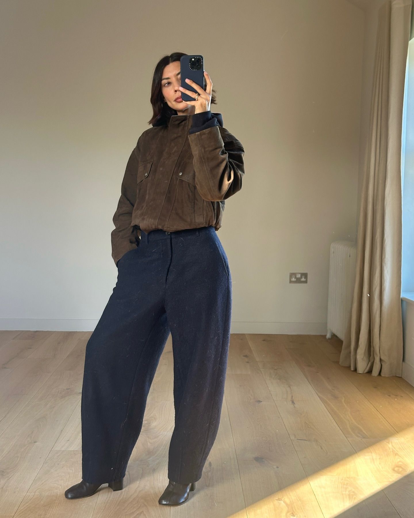 Stylish women wearing black and brown outfits