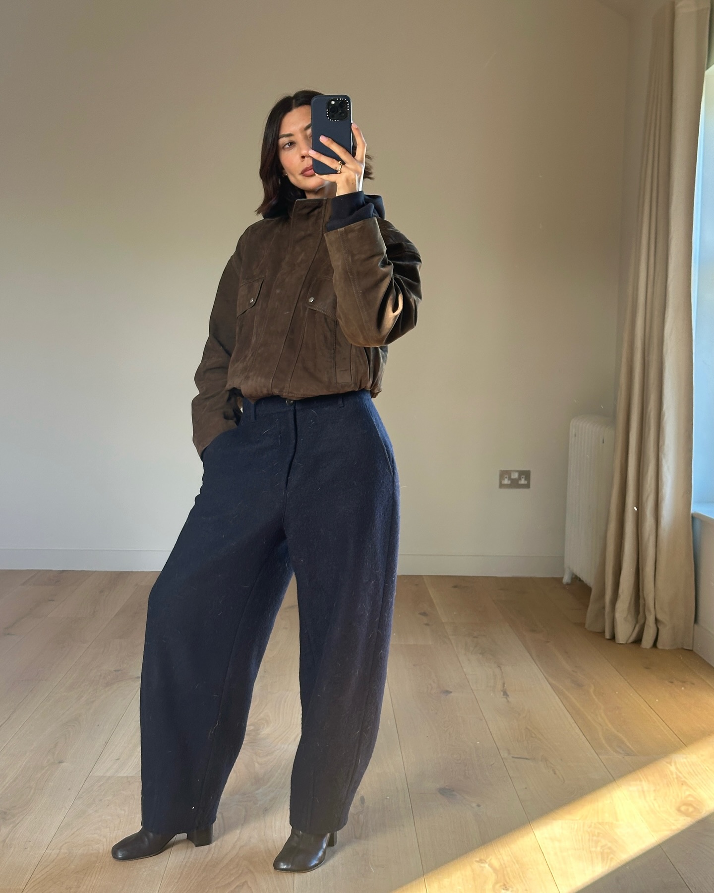 Stylish women wearing black and brown outfits