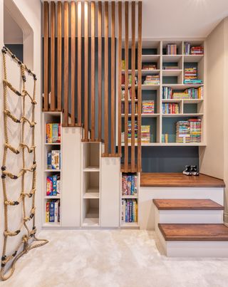 kids playroom with storage built into the stairs