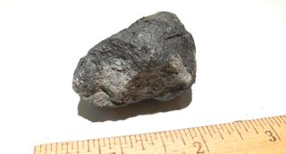 This photo shows the Novato meteorite N1 discovered by Lisa Webber of Novato, Calif. The meteorite is from a meteor that created a spectacular fireball over Northern California on Oct. 17, 2012