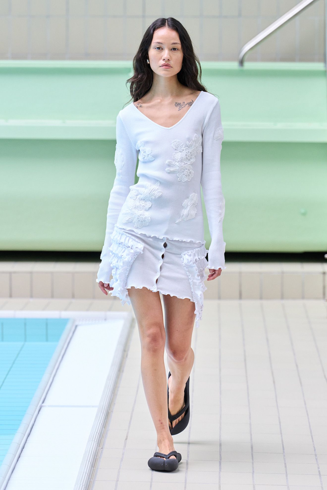 Model wears textured florals on the Opera Sport spring summer 2026 runway.