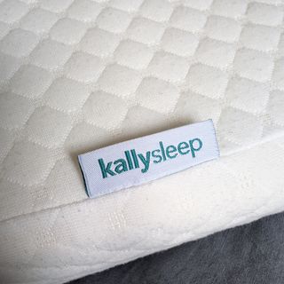 The Kally Sleep Neck Pain Pillow being tested