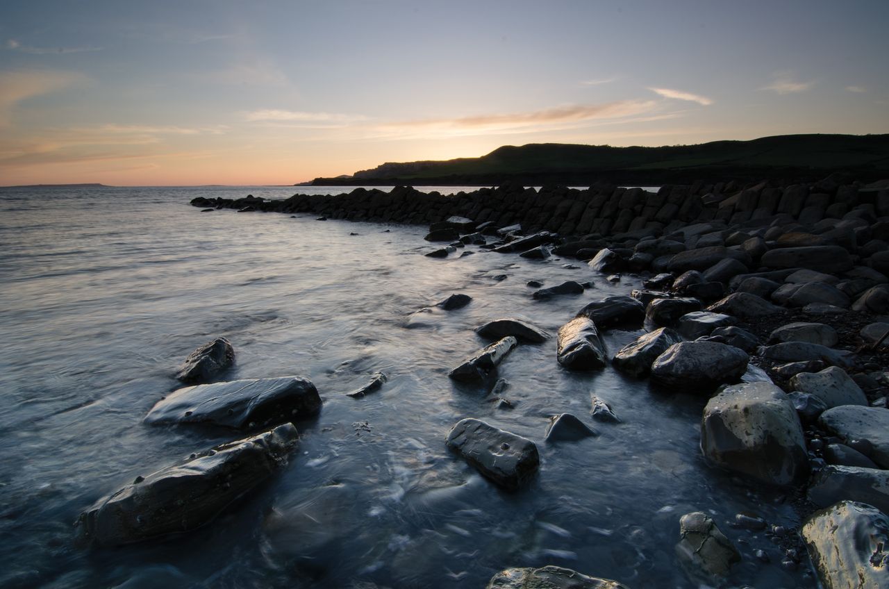 This has lightened the image, but notice the longer exposure has also blurred the water