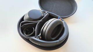 Sony WH-XB910N review: headphones in a case on a white background