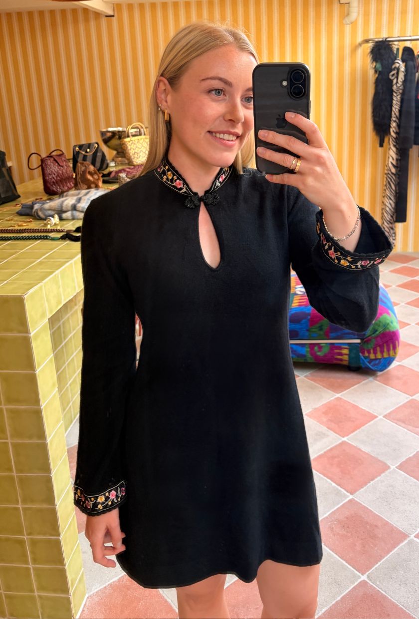 Florrie wears the Valerria Embroidered Merino Cashmere Mini Dress