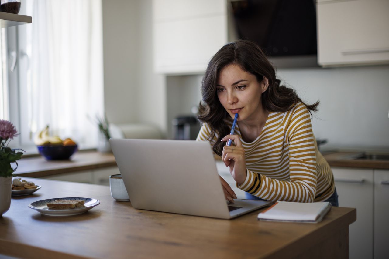 Woman researching funds on a laptop