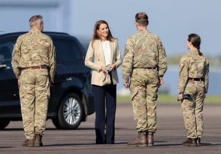 Kate Middleton outfit at BRIZE NORTON, ENGLAND - SEPTEMBER 15: Catherine, Duchess of Cambridge arrives to meet those who supported the UK's evacuation of civilians from Afghanistan, at RAF Brize Norton on September 15, 2021 in Brize Norton, England. Operation PITTING, the largest humanitarian aid operation for over 70 years, ran between 14th and 28th August, where in excess of 15,000 people were flown out of Kabul by the Royal Air Force. (Photo by Chris Jackson/Getty Images)