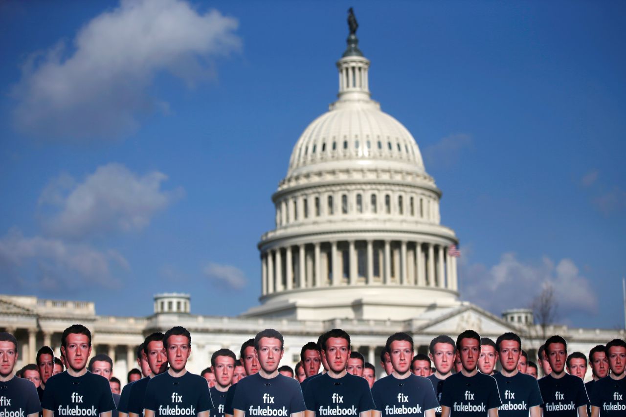 Cutouts of Mark Zuckerberg.