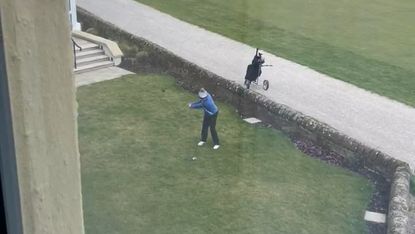 A player takes a shot from the Old Course Hotel garden at St Andrews