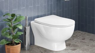 white back to wall toilet with grey blue tiles