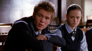 Tristan and Rory sitting next to each other on Gilmore Girls.